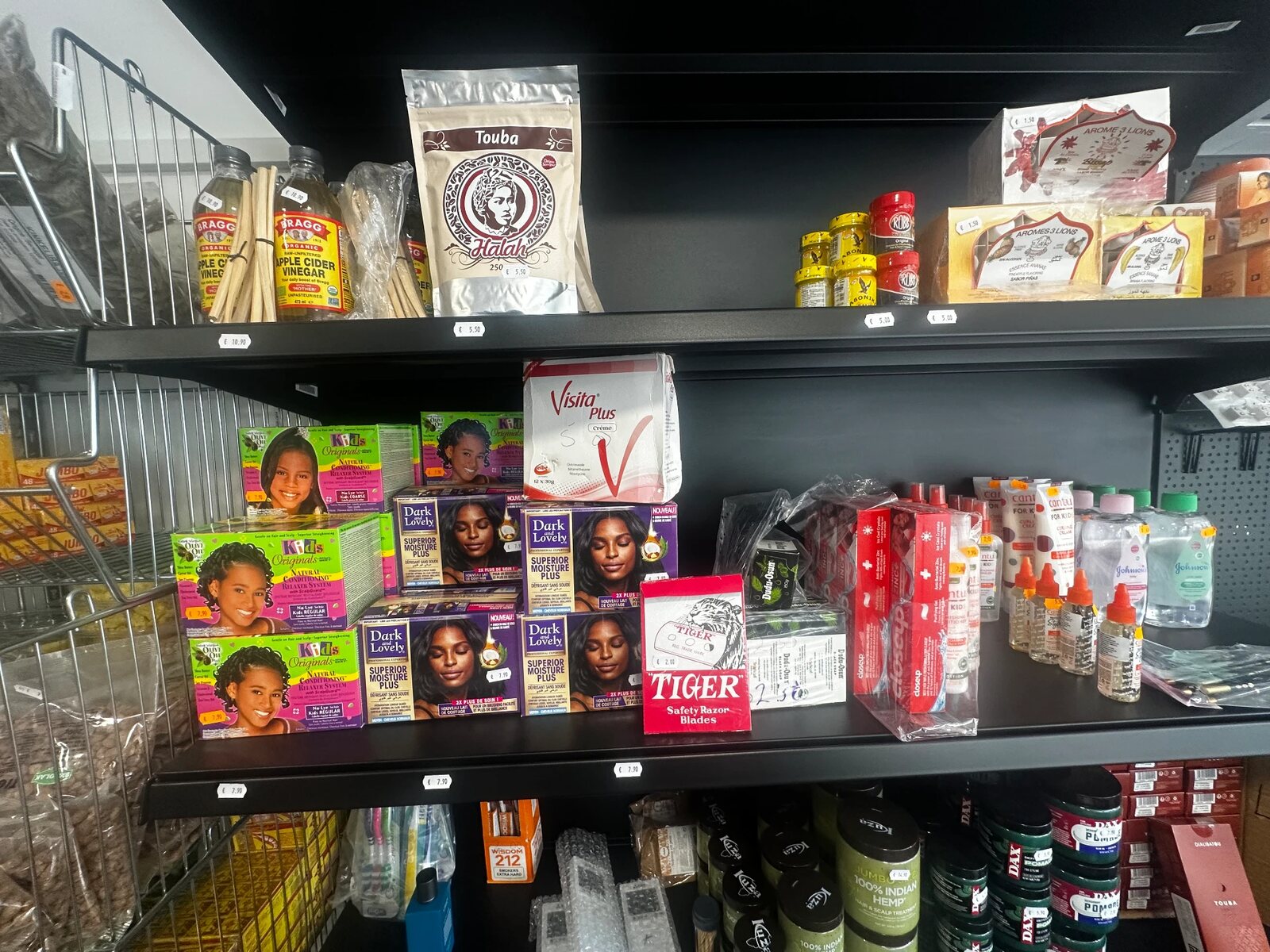 Hair care and beauty products on the shelves at TEGA AFRO STORE
